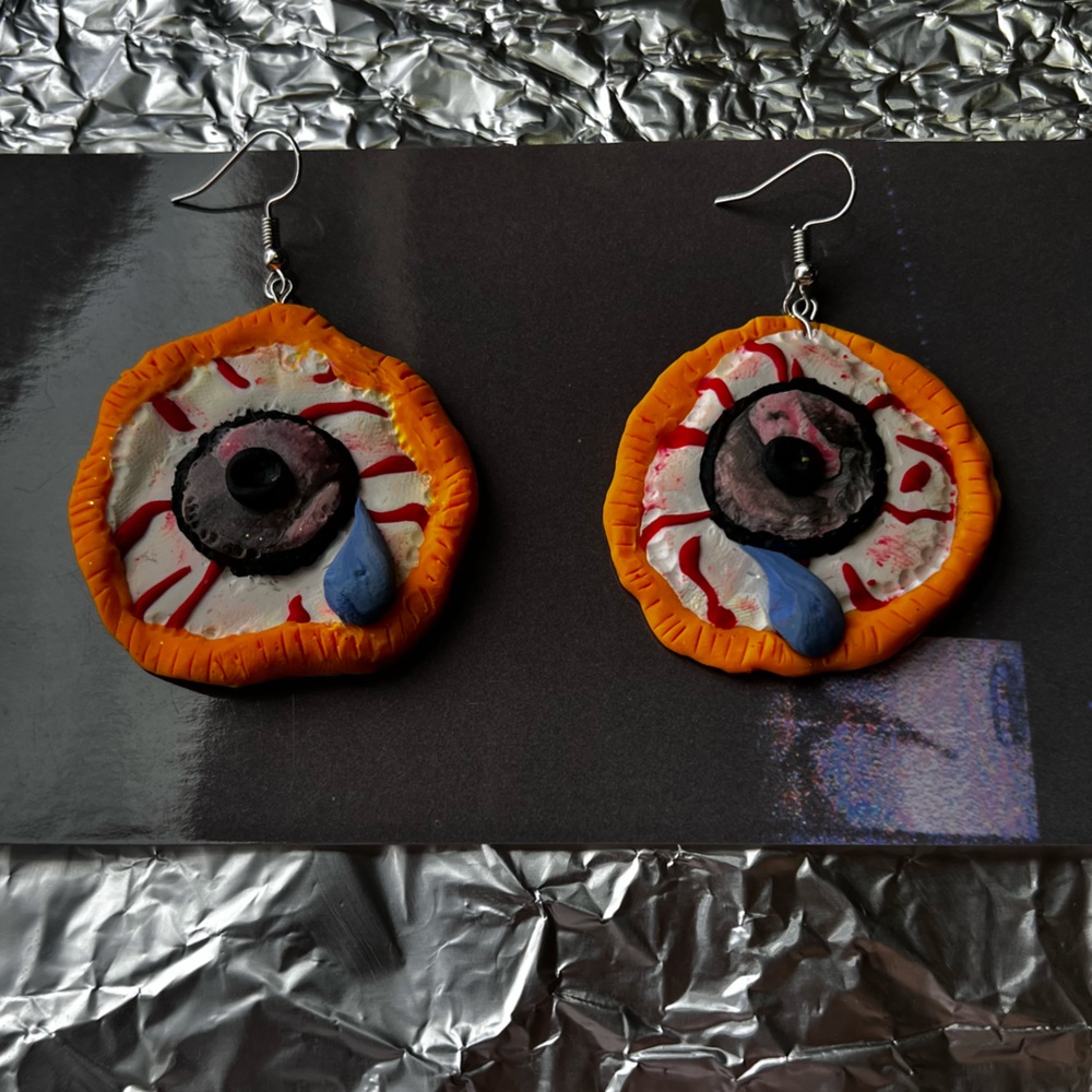 Crying Eyepies 
Handmade weird crying clay earrings